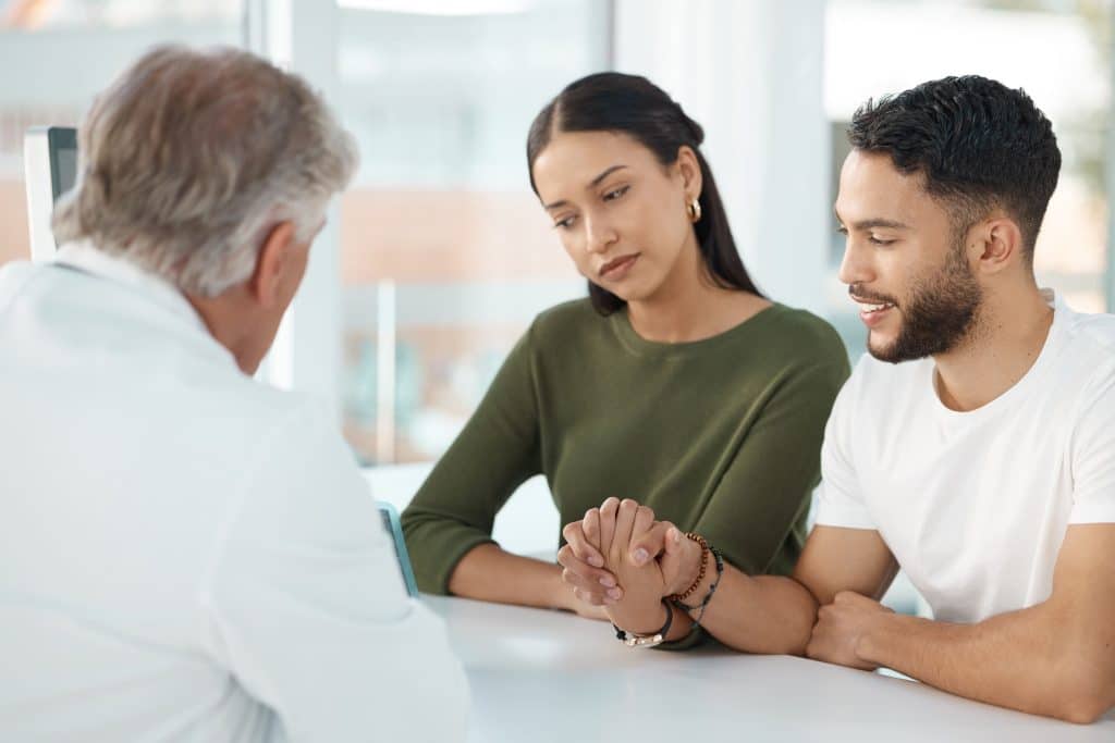 man and woman during doctor's consultation
